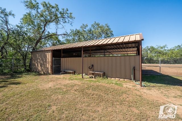 view of outdoor structure with a lawn