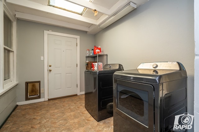 laundry room with washer and dryer