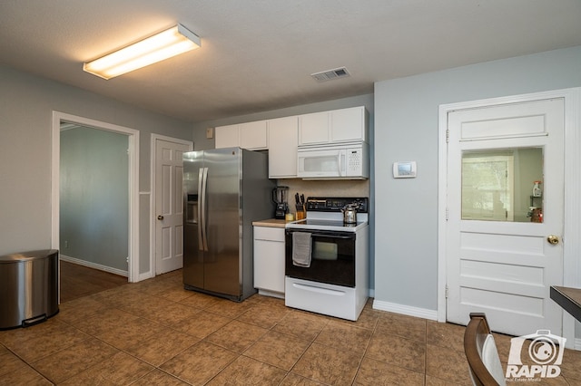 kitchen with dark tile patterned flooring, white cabinets, stainless steel fridge with ice dispenser, a textured ceiling, and electric stove