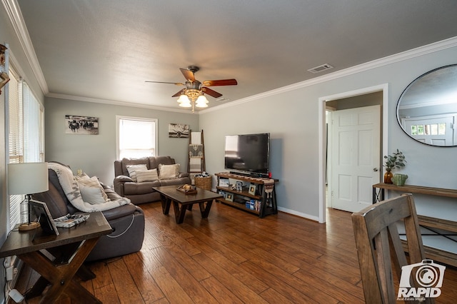 living room with dark hardwood / wood-style flooring, crown molding, and ceiling fan