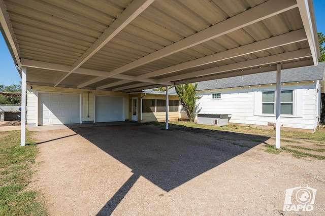 view of patio featuring a garage and a carport