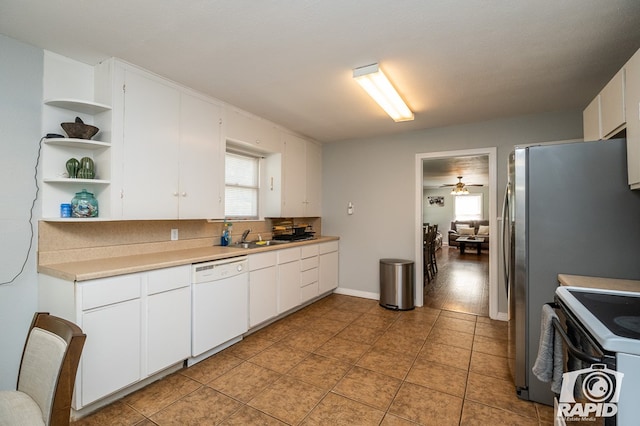 kitchen with white dishwasher, white cabinetry, and range with electric cooktop