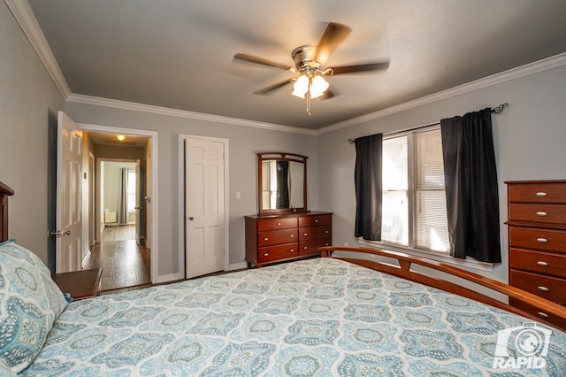 bedroom featuring ornamental molding and ceiling fan