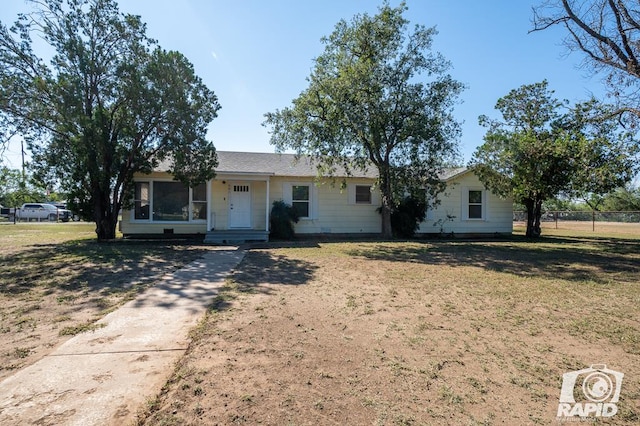 ranch-style house with a front yard