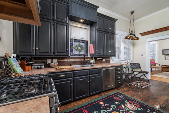 kitchen with appliances with stainless steel finishes, dark hardwood / wood-style floors, sink, hanging light fixtures, and ornamental molding