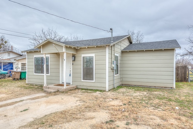 419E 29th St, San Angelo, TX 76903 - bungalow-style house with fence and a shingled roof