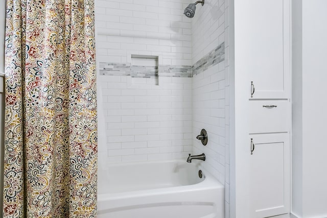 bathroom featuring shower / bathtub combination with curtain