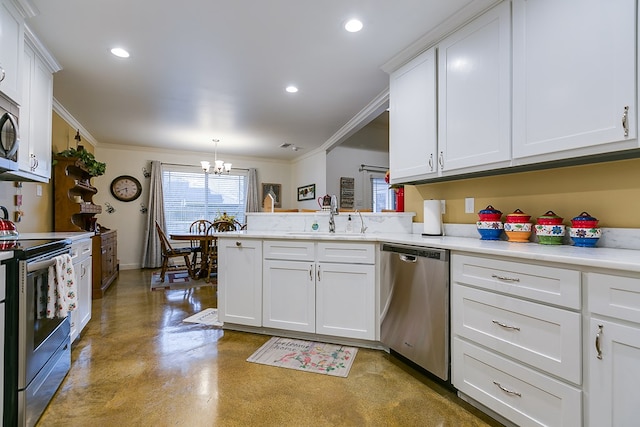 kitchen featuring stainless steel appliances, a peninsula, a sink, and white cabinets