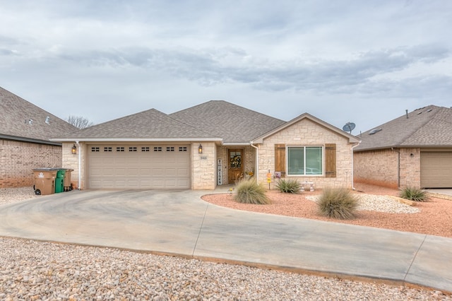 ranch-style house featuring an attached garage, stone siding, a shingled roof, and concrete driveway