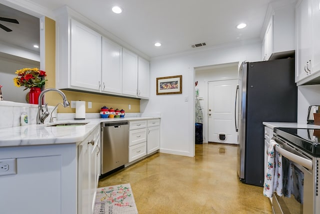 kitchen featuring stainless steel appliances, a sink, and white cabinets