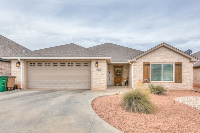 single story home with driveway, stone siding, a shingled roof, and an attached garage