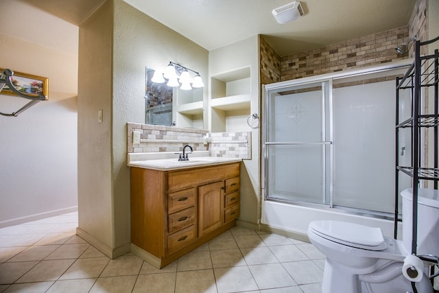 220 Mcdowell St, Bronte, TX 76933 - bathroom featuring vanity, decorative backsplash, tile patterned flooring, and combined bath / shower with glass door