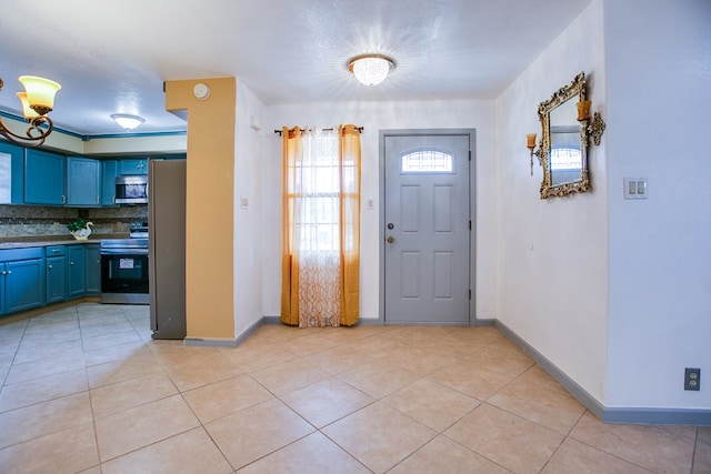 220 Mcdowell St, Bronte, TX 76933 - foyer featuring light tile patterned floors and baseboards