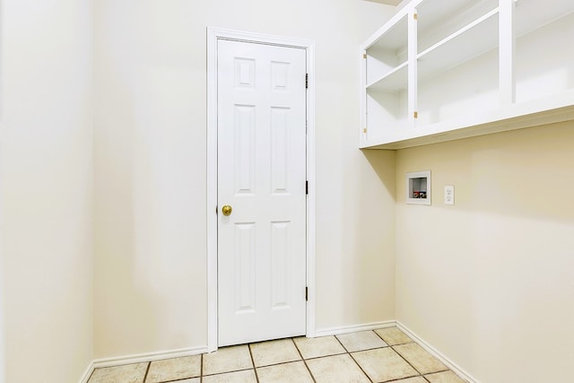 55 Southridge Dr, San Angelo, TX 76904 - laundry room with hookup for a washing machine, light tile patterned floors, and baseboards