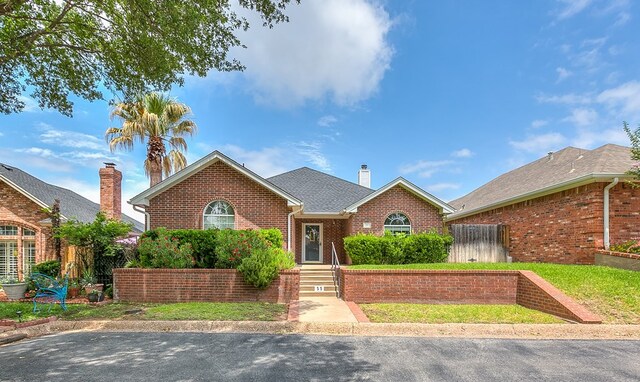 55 Southridge Dr, San Angelo, TX 76904 - unfurnished living room with a ceiling fan, a fireplace, dark wood-style flooring, baseboards, and lofted ceiling