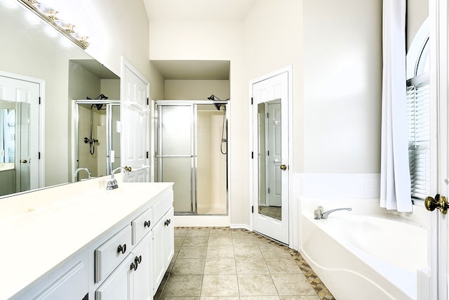 55 Southridge Dr, San Angelo, TX 76904 - full bathroom with a stall shower, vanity, and a garden tub