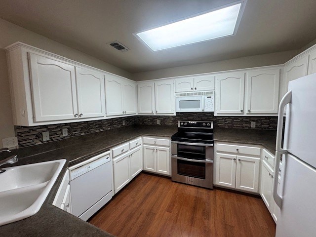 55 Southridge Dr, San Angelo, TX 76904 - kitchen with white appliances, a sink, and white cabinets