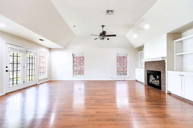 55 Southridge Dr, San Angelo, TX 76904 - unfurnished living room featuring ceiling fan, built in features, wood finished floors, recessed lighting, and vaulted ceiling