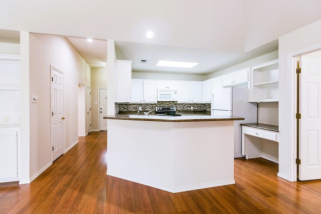 55 Southridge Dr, San Angelo, TX 76904 - kitchen featuring white appliances, dark countertops, open shelves, dark wood-style floors, and recessed lighting