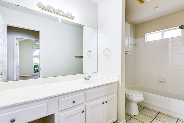 55 Southridge Dr, San Angelo, TX 76904 - bathroom featuring toilet, vanity, tile patterned floors, and healthy amount of natural light