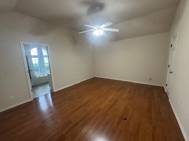 55 Southridge Dr, San Angelo, TX 76904 - empty room with lofted ceiling, wood finished floors, ceiling fan, a textured ceiling, and baseboards