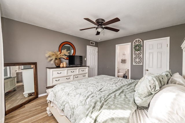 bedroom featuring ceiling fan, connected bathroom, and light hardwood / wood-style floors