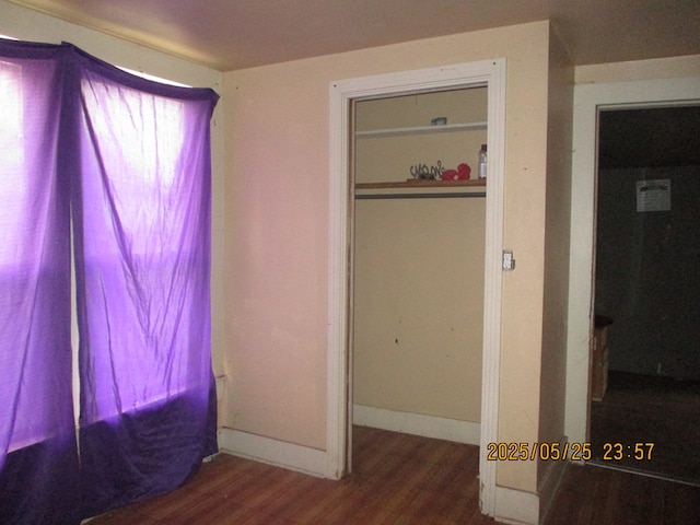 621 E Harris Ave, San Angelo, TX 76903 - bedroom with wood finished floors and baseboards