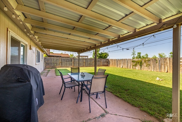 213 Amistad Rd, San Angelo, TX 76901 - fenced backyard featuring a patio area, a grill, and outdoor dining space
