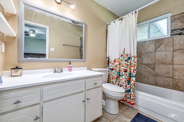 213 Amistad Rd, San Angelo, TX 76901 - bathroom with tile patterned floors, vanity, shower / tub combo, a textured ceiling, and a ceiling fan
