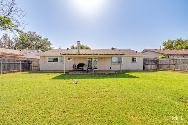 213 Amistad Rd, San Angelo, TX 76901 - rear view of property with a patio area and a fenced backyard