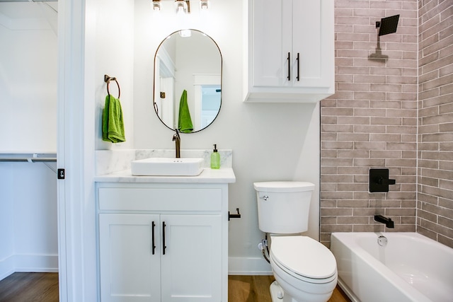 3609 Clearview Dr, San Angelo, TX 76904 - full bathroom with vanity, washtub / shower combination, wood finished floors, and a closet
