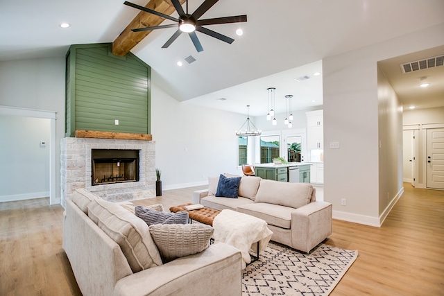 3609 Clearview Dr, San Angelo, TX 76904 - living area featuring a ceiling fan, light wood-type flooring, a fireplace, recessed lighting, and a chandelier