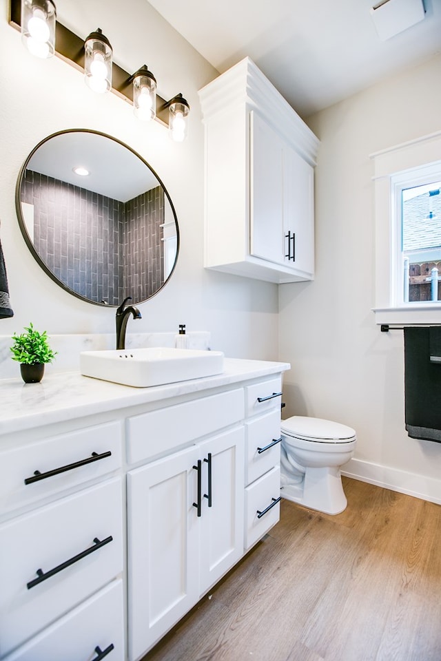 3609 Clearview Dr, San Angelo, TX 76904 - bathroom featuring wood finished floors and vanity