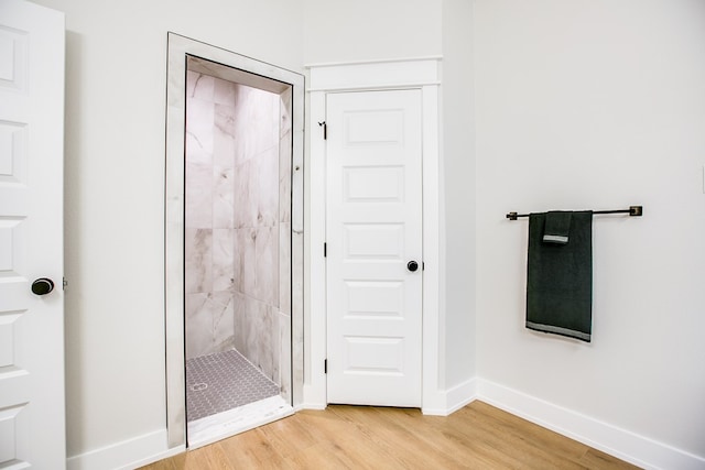 3609 Clearview Dr, San Angelo, TX 76904 - bathroom featuring wood finished floors and a stall shower