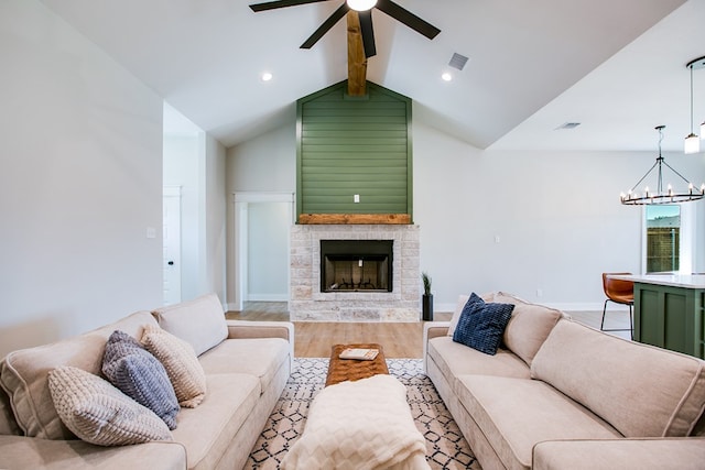 3609 Clearview Dr, San Angelo, TX 76904 - living room with a chandelier, ceiling fan, light wood-style flooring, a stone fireplace, and recessed lighting