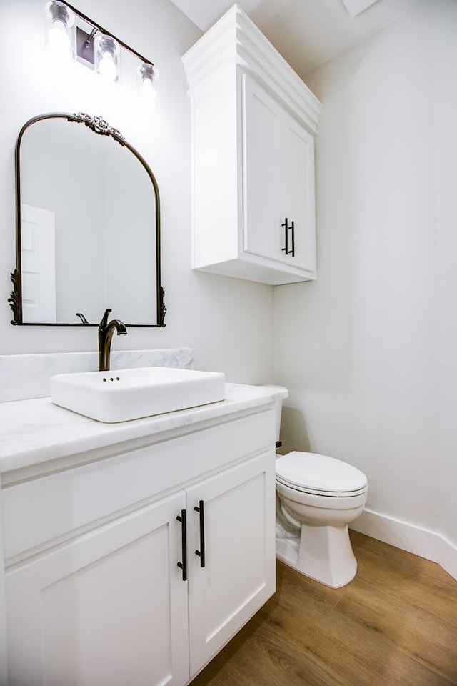 3609 Clearview Dr, San Angelo, TX 76904 - half bath with vanity and wood finished floors