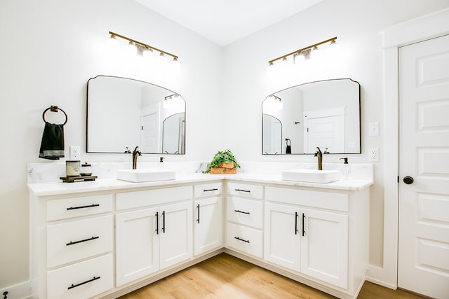 3609 Clearview Dr, San Angelo, TX 76904 - bathroom featuring double vanity and wood finished floors