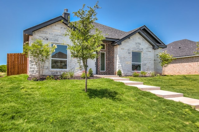 3609 Clearview Dr, San Angelo, TX 76904 - view of front of house featuring stone siding and a chimney