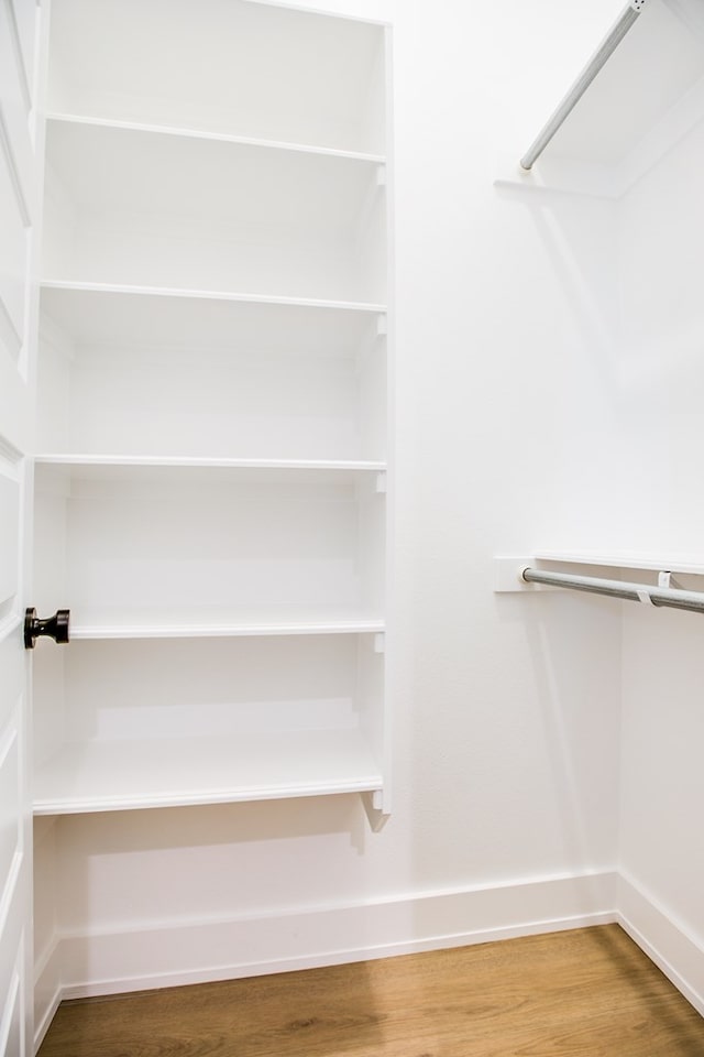 3609 Clearview Dr, San Angelo, TX 76904 - walk in closet featuring wood finished floors