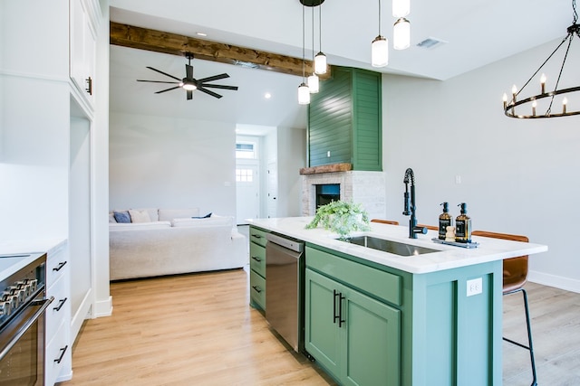 3609 Clearview Dr, San Angelo, TX 76904 - kitchen featuring green cabinetry, stainless steel dishwasher, stove, light wood-type flooring, and a ceiling fan
