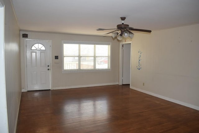 entrance foyer with ornamental molding, dark hardwood / wood-style floors, and a wealth of natural light