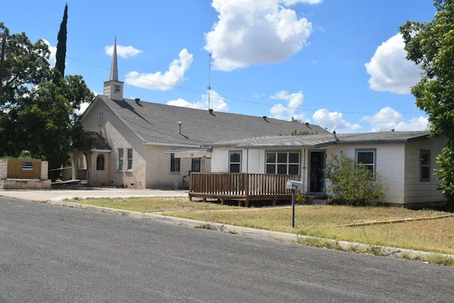 view of front of home with a wooden deck