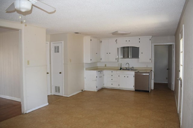 kitchen with dishwasher, sink, a textured ceiling, and white cabinets