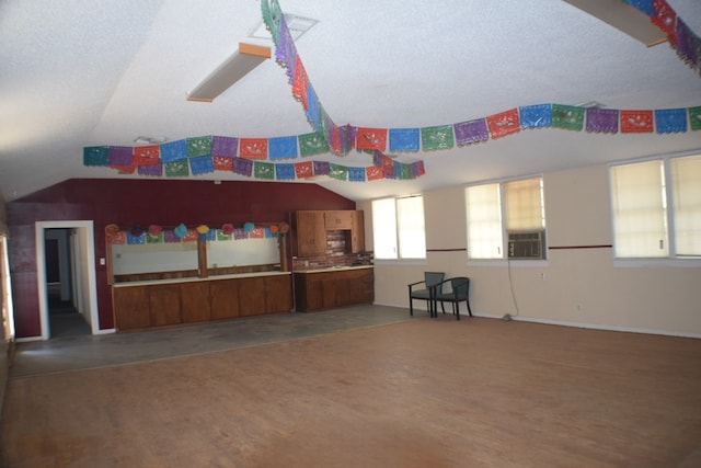 interior space with hardwood / wood-style flooring, lofted ceiling, and cooling unit