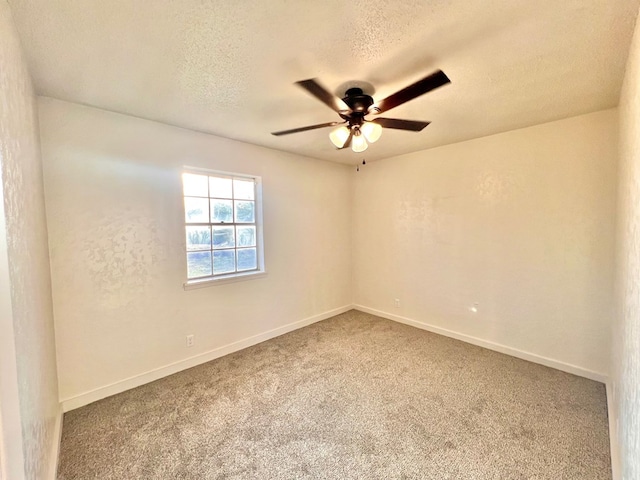 2726 Erline Dr, San Angelo, TX 76901 - spare room featuring a ceiling fan, carpet floors, baseboards, and a textured ceiling