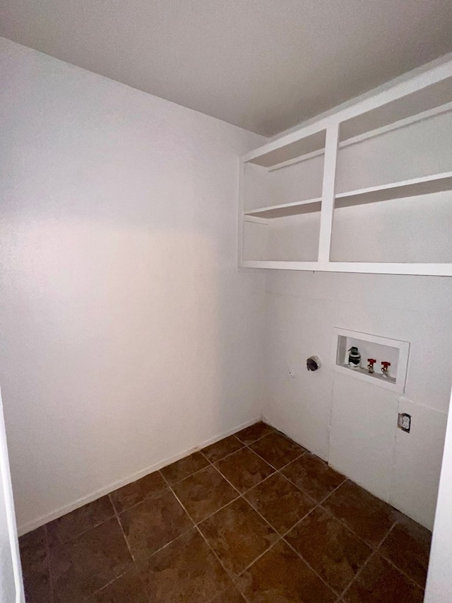 2726 Erline Dr, San Angelo, TX 76901 - washroom with washer hookup, hookup for an electric dryer, and dark tile patterned flooring