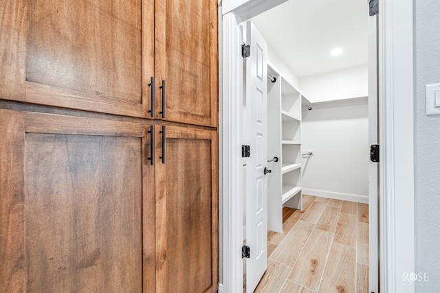 2301 Hillside Dr, San Angelo, TX 76904 - walk in closet with light wood finished floors
