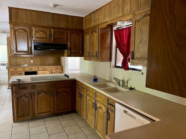 165 Edinburgh Rd, San Angelo, TX 76901 - kitchen featuring a sink, light tile patterned floors, white dishwasher, and under cabinet range hood