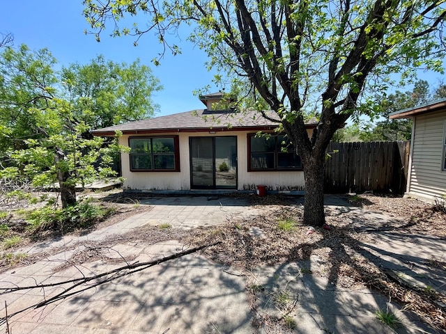 165 Edinburgh Rd, San Angelo, TX 76901 - back of house with fence, a patio, and roof with shingles