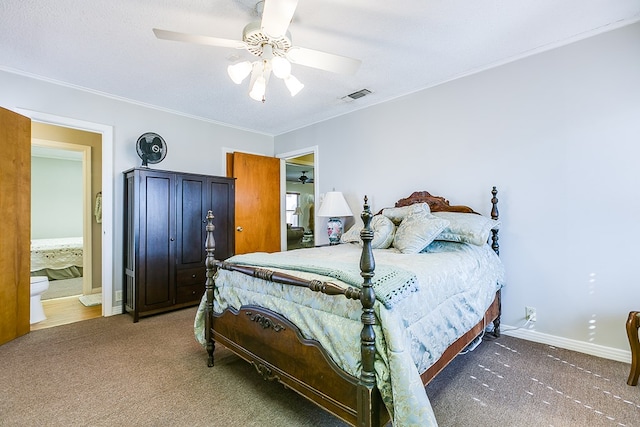 carpeted bedroom featuring ceiling fan, ornamental molding, and a textured ceiling